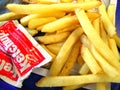 French Fries With Ketchup Packets Royalty Free Stock Photo