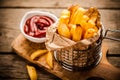 French fries on wooden table Royalty Free Stock Photo