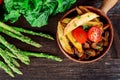 French fries with mushrooms and tomato, asparagus,lettuce Royalty Free Stock Photo