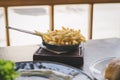 Delicious french fries. French fries in pan in restaurant