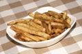 A plate of seasoned french fries