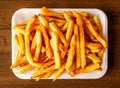 French fries or potato chips served in dish isolated on wooden background top view of indian spices and pakistani food Royalty Free Stock Photo