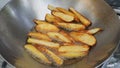 French fries potato snacks cooking with palm oil in pan