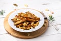 French fries poutine dish on white