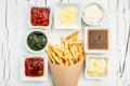 French fries with sauces on white background, top view Royalty Free Stock Photo