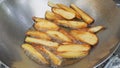 French fries is scorch cooking in hot pan Royalty Free Stock Photo