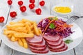 French fries and sliced smoked veal with cabbage salad Royalty Free Stock Photo