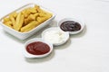 French fries with three dips, barbecue, mayo and ketchup Royalty Free Stock Photo