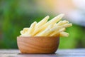 French fries in wooden bowl delicious Italian meny homemade ingredients on table nature green background - Tasty potato fries for Royalty Free Stock Photo
