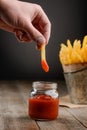 French fry dipped in ketchup Royalty Free Stock Photo