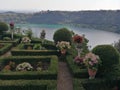 French garden with behind the Volcanic lake of Nemi in Italy.