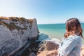 A French girl watching the Etretat cliffs Royalty Free Stock Photo