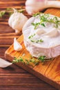 French homemade Camembert cheese with thyme and garlic