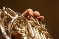 French horn in the hands of a musician closeup Royalty Free Stock Photo