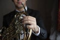 French horn instrument. Hands playing horn player Royalty Free Stock Photo