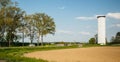 French intersection with cars and big water tower Royalty Free Stock Photo