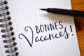 French language BONNES VACANCES! hand-lettered in notebook