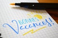 French language BONNES VACANCES! hand-lettered in notebook