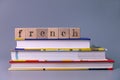 French language course and learning concept. stack of books with wooden blocks Royalty Free Stock Photo