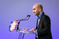 French left-wing politician Arash Saeidi giving a speech at a rally