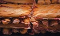 French loaf with Spanish jamon. Traditional Spanish Ham. Thin slices of the Iberico jamon between two piece Royalty Free Stock Photo