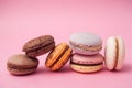 french macarons pile on pink background