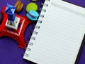 French macaroons with dried flower and empty notebook page background Royalty Free Stock Photo