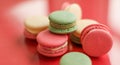 French macaroons on red background, parisian chic cafe dessert, sweet food and cake macaron for luxury confectionery brand, Royalty Free Stock Photo