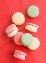 French macaroons on red background, parisian chic cafe dessert, sweet food and cake macaron for luxury confectionery brand, Royalty Free Stock Photo