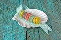 French macaroons on seashell plate