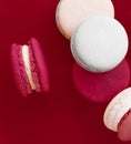 French macaroons on wine red background, parisian chic cafe dessert, sweet food and cake macaron for luxury confectionery brand, Royalty Free Stock Photo