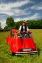 French man with his typical red car Royalty Free Stock Photo