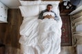 French man sleeping alone on bed Royalty Free Stock Photo