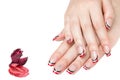French manicure - beautiful manicured female hands with red black and white manicure with rhinestones isolated on white background Royalty Free Stock Photo