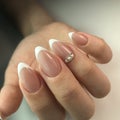 French manicure on the nails. French manicure design. Manicure gel nail polish Royalty Free Stock Photo