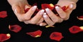 French manicure and rose petals Royalty Free Stock Photo