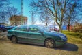 French private car old green sedan Citroen C5 right side and front view parked