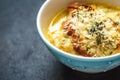 French onion soup in blue ceramic bowl Royalty Free Stock Photo