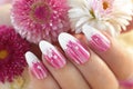 French oval manicure with a striped gradient in pink tones.