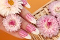 French oval manicure with a striped gradient in pink tones.