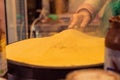 French pancake cooking process. Street food in Paris.