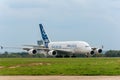 French passenger four-engine wide-body aircraft Airbus A-380 on concrete runway after landing.