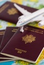 French passports on map and plane background Royalty Free Stock Photo