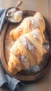 French pastry allure croissant bread presented on a wooden plate