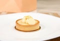 French patisserie. Still life with a delicious tartlet with lemon on a white plate