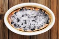 French pie clafoutis with cherry and icing sugar in white oval b Royalty Free Stock Photo