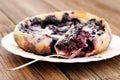 French pie clafoutis with cherry and spoon in white plate Royalty Free Stock Photo