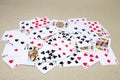 French playing cards scattered face-up on the cloth surface Royalty Free Stock Photo