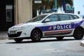 French Police Car Driving Fast in The City Center