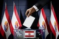 French Polynesia flags, hand dropping ballot card into a box - voting, election concept